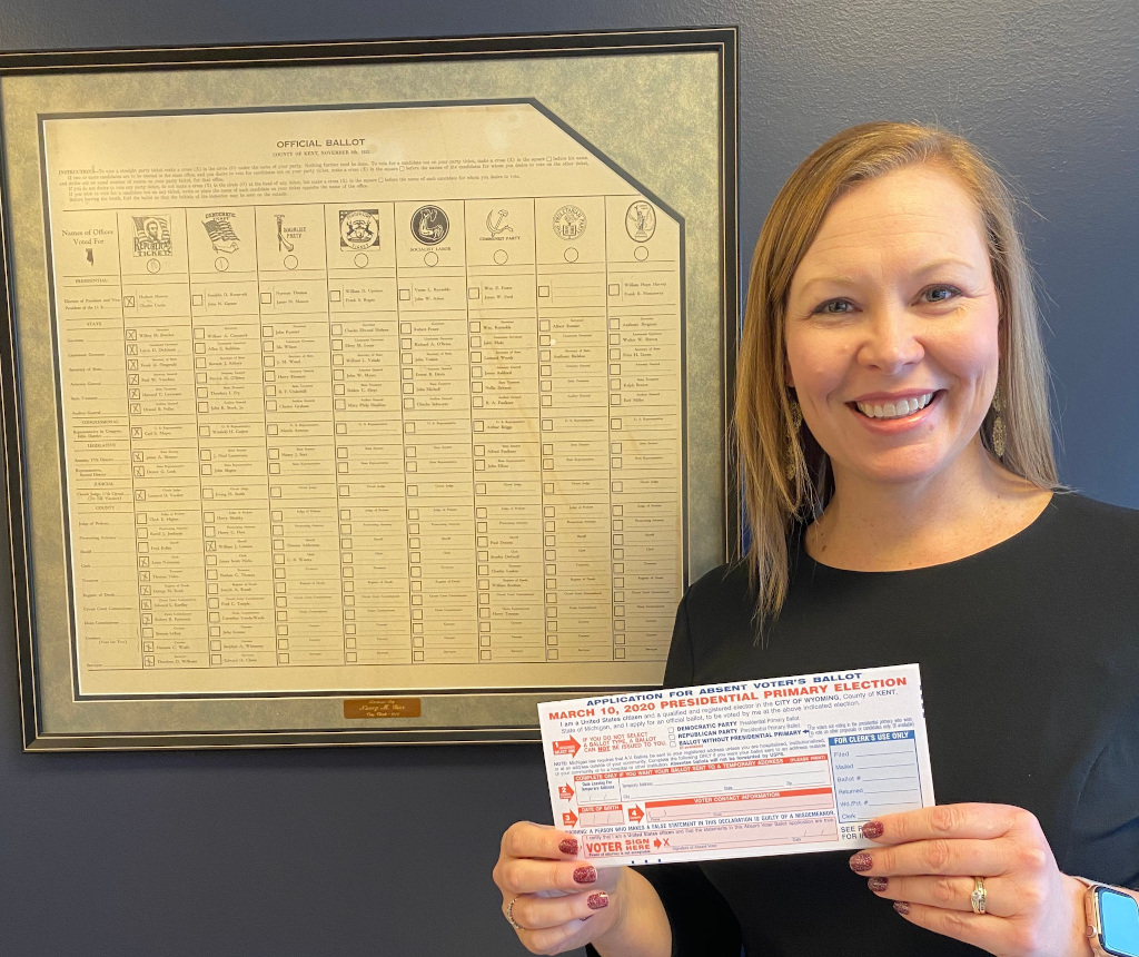 City Clerk, Kelli Vandenberg, holding an absentee ballot application to vote for the March 10, 2020 election